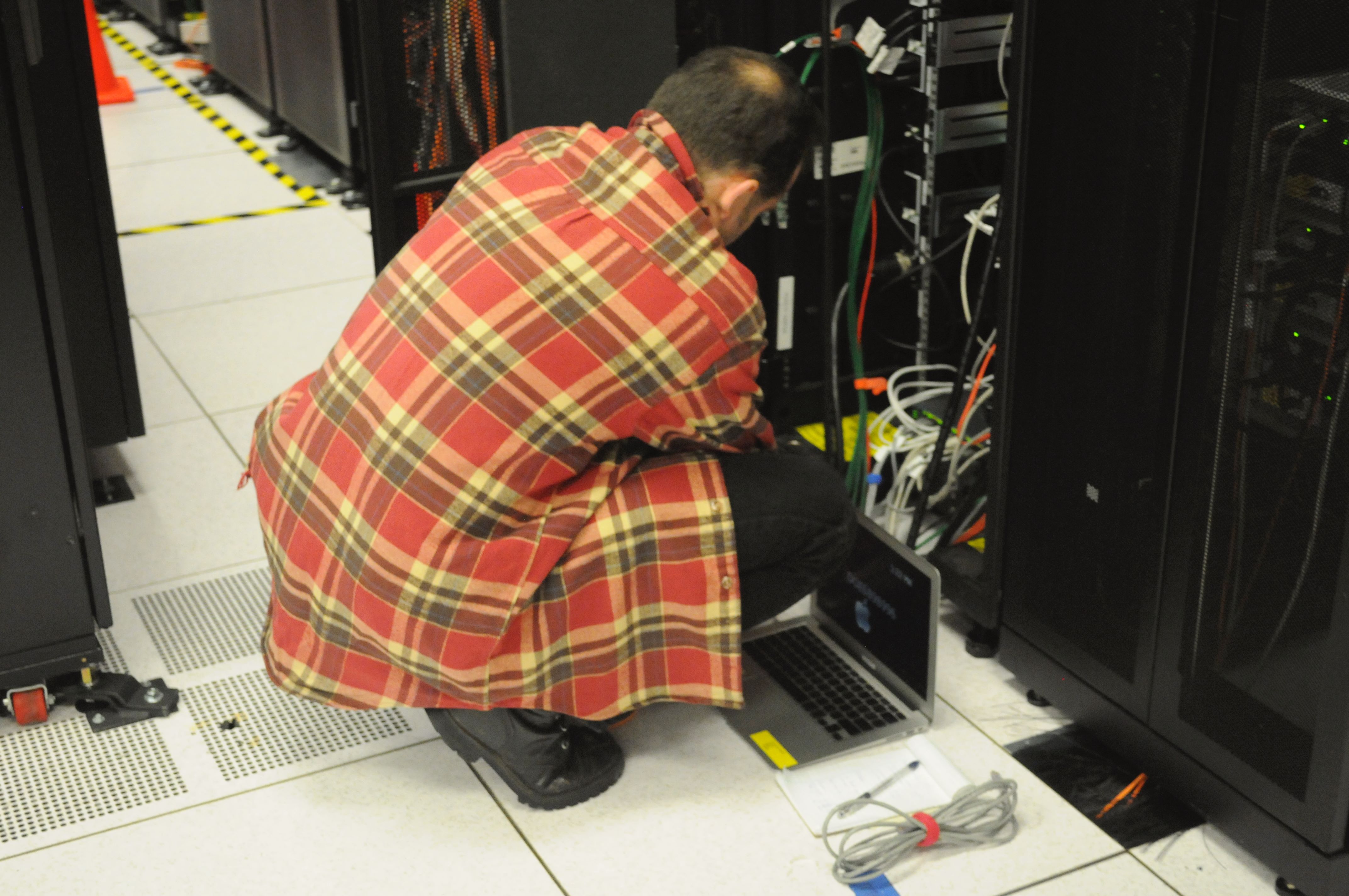 Technician working on server rack